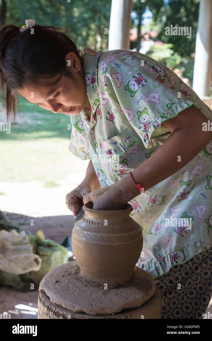 Woman makes ceramic vase in a pottery village, Andong Russei, Kampong Chhnang, Cambodia, Asia Stock Photo