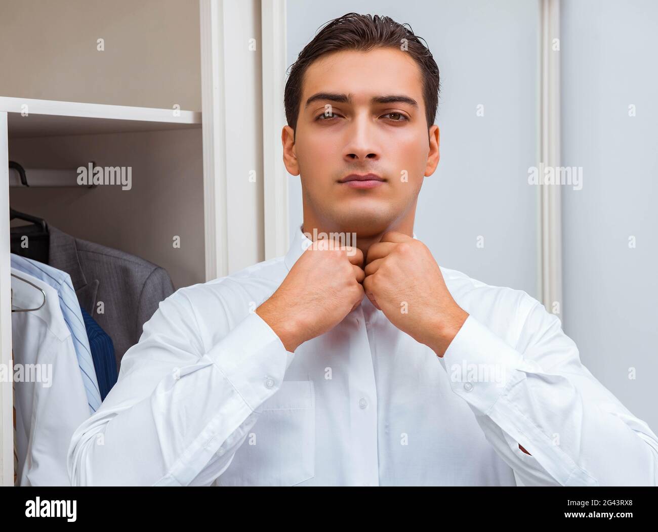 Businessman dressing up for work Stock Photo Alamy