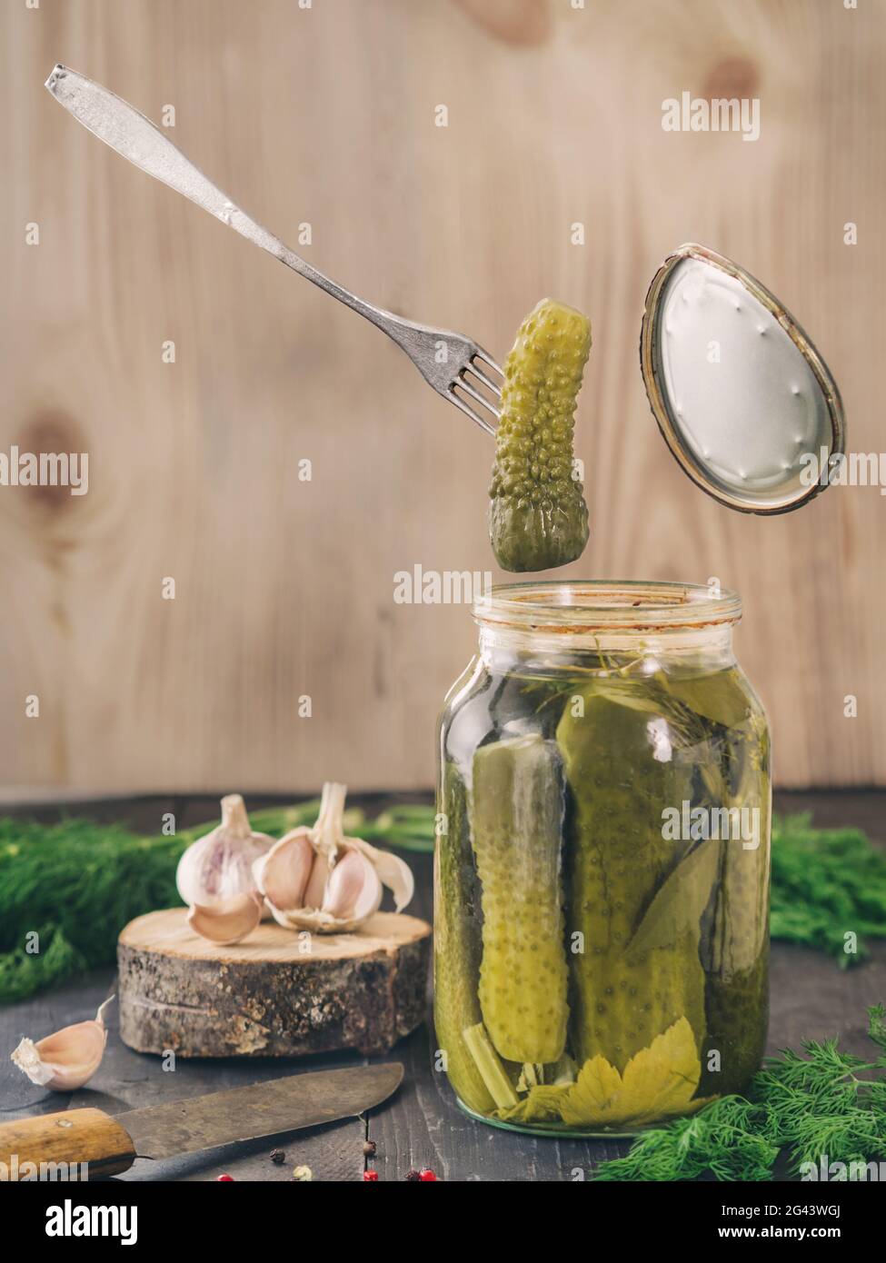 Pickled cucumbers on wooden background Pickled cucumbers on wooden background Stock Photo