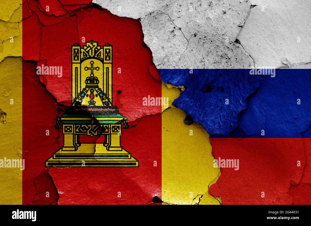 Flags of Tver Oblast and Russia painted on cracked wall Stock Photo