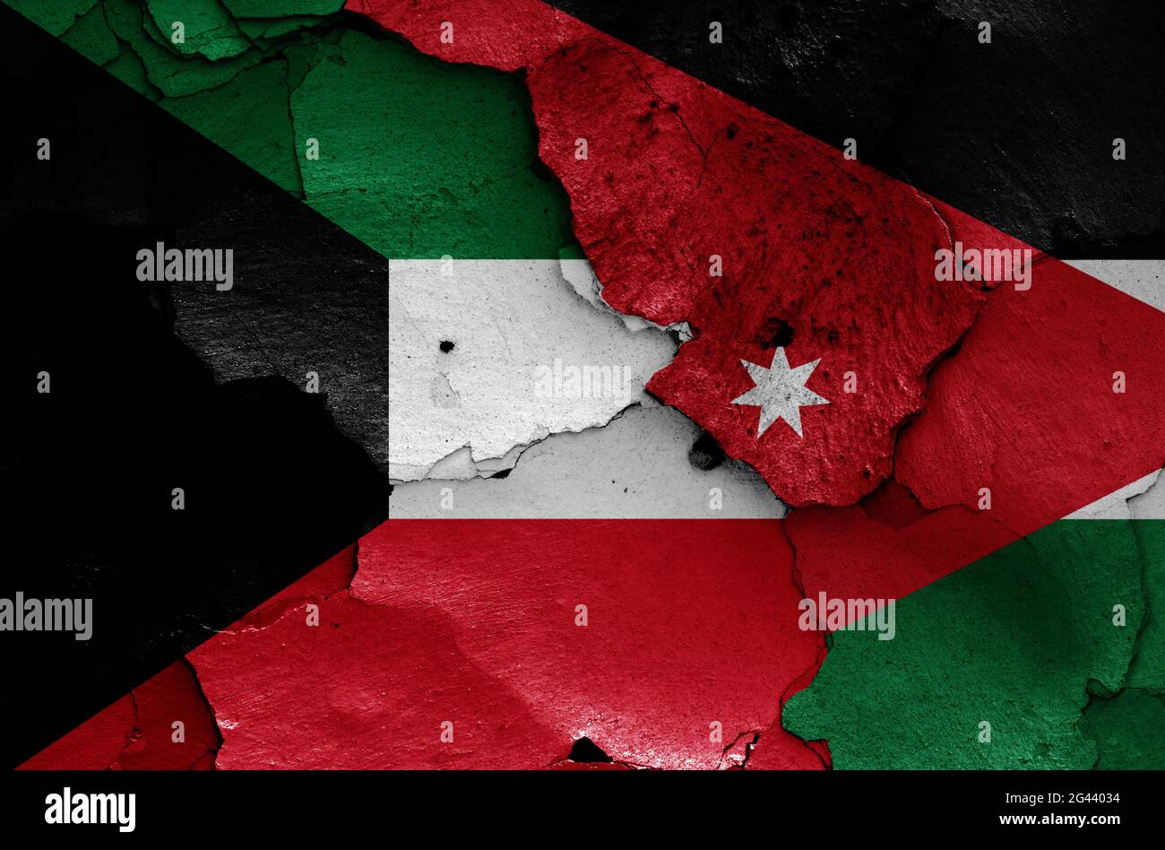 Flags of Kuwait and Jordan painted on cracked wall Stock Photo