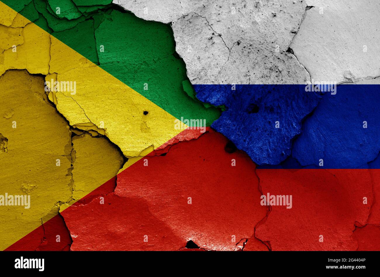 Flags of Zabaykalsky Krai and Russia painted on cracked wall Stock Photo