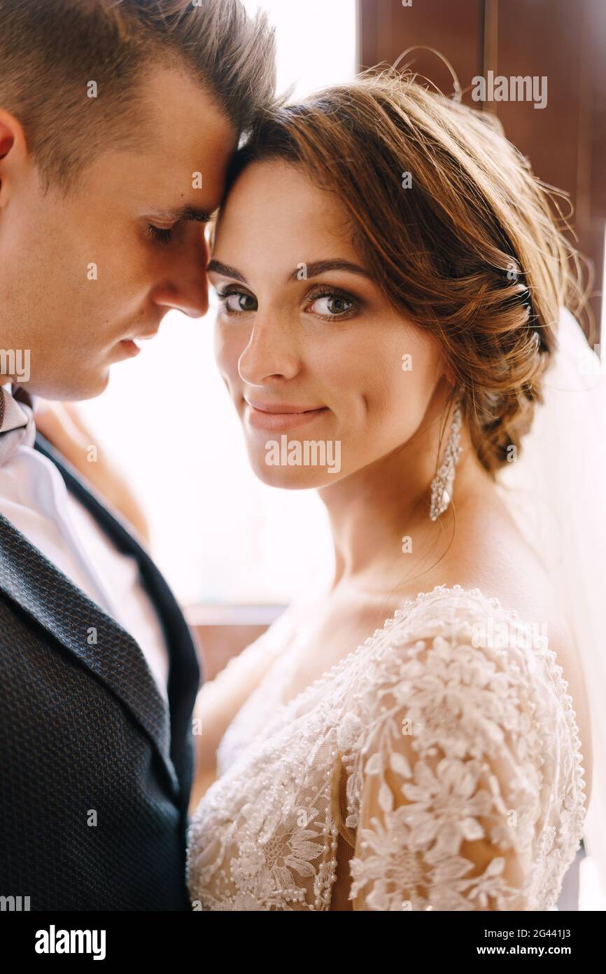 Forehead Rests Against Another Fine-art wedding photo in Montenegro, Perast. Close-up portrait of a ...