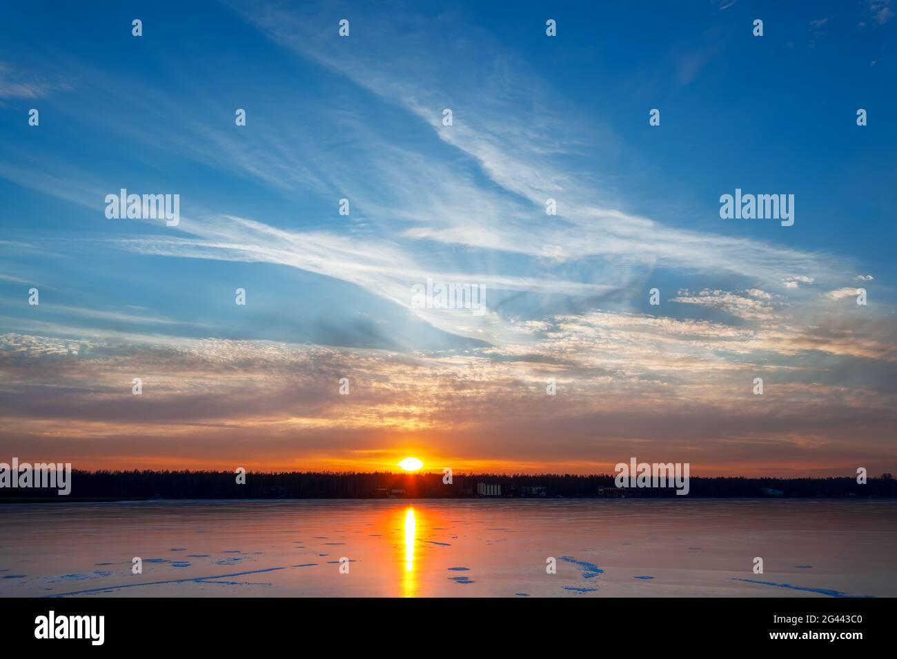 Sunset over the winter lake Stock Photo