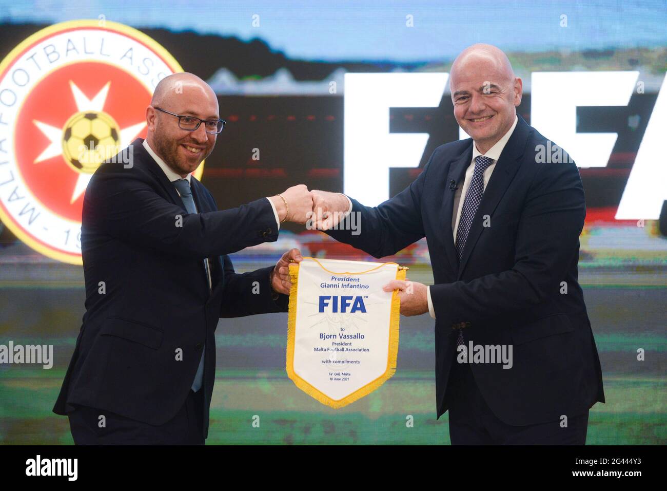 Ta'qali, Malta. 18th June, 2021. FIFA President Gianni Infantino (R) and president of Malta Football Association Bjorn Vassallo are seen to take photo during a press conference in Ta'Qali, Malta, June 18, 2021. Gianni Infantino visited Malta on Friday on an invitation of Malta Football Association President Bjorn Vassallo to hold bilateral discussions on the development of Maltese football and how Malta can contribute further to the international football community. Credit: Jonathan Borg/Xinhua/Alamy Live News Stock Photo