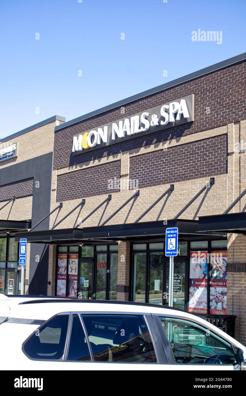 Augusta, Ga USA 03 04 21 Moon Nails and Spa entrance sign and car