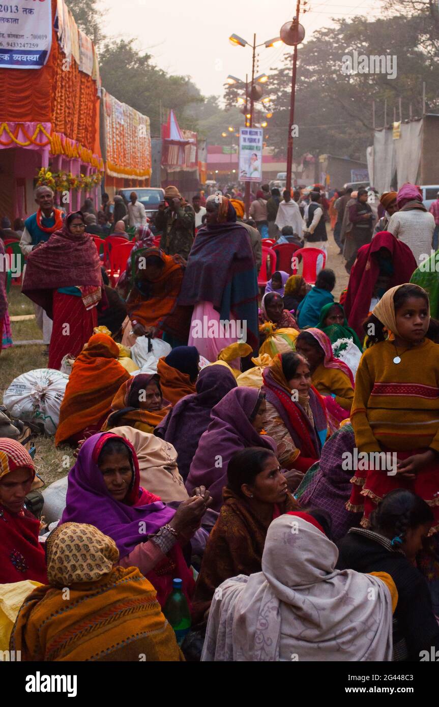 BABUGHAT, KOLKATA, WEST BENGAL / INDIA - 9TH JANUARY 2013 : Female devotees gossiping  on 9th January, 2013 at Babughat, Kolkata. Yearly event. Stock Photo