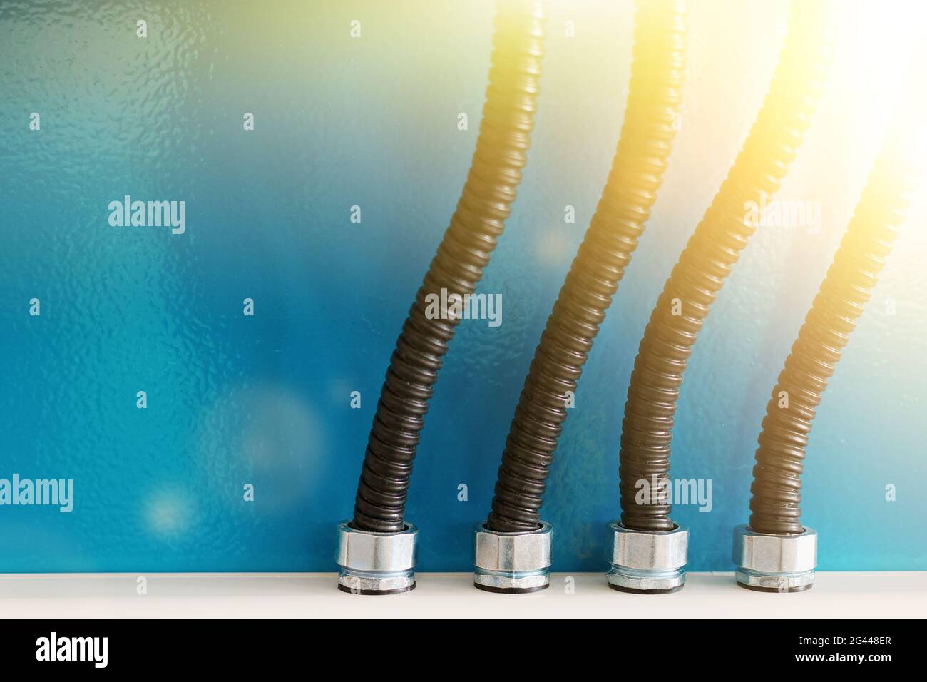 The electrical wires in the corrugated protection are attached to the