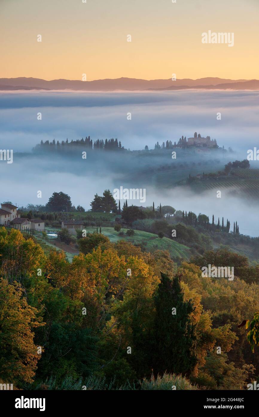 Foggy morning in autumn below San Gimignano, Tuscany, Italy, Europe Stock Photo