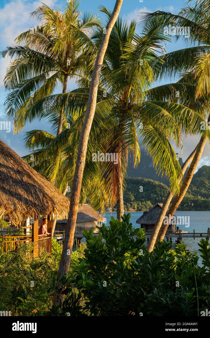 A Young Blonde Woman Looks From The Balcony Of Her Honeymoon Suite Amid ...