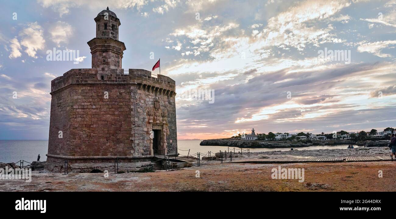 Saint Nicolau Castle on beach at sunset, Ciutadella, Menorca, Spain Stock Photo