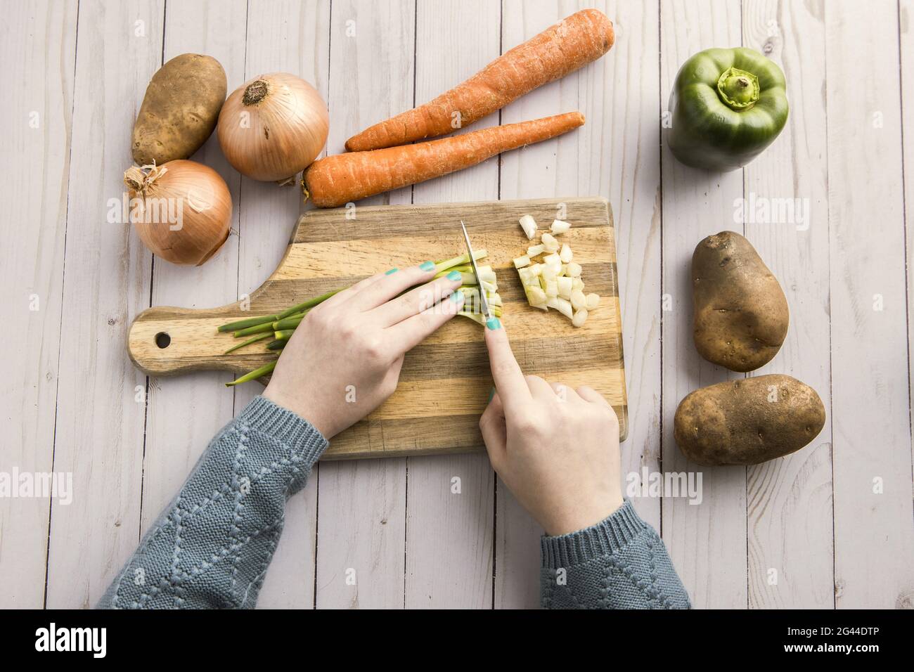 Cutting up various veggies Stock Photo Alamy