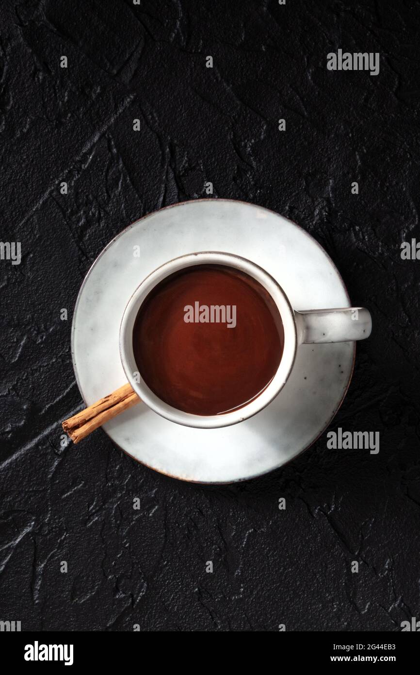 Hot chocolate in a cup, shot from above on a black background Stock Photo