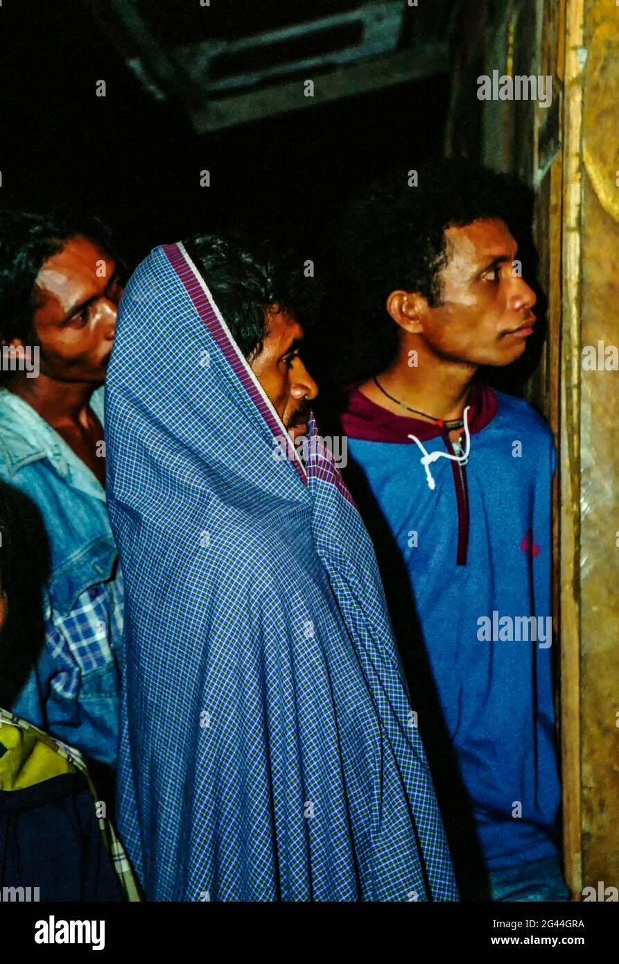 May 20, 2002-Atambua, Indonesia-In This Photos taken Independence day scene and Timorese daily life on 7day in Dili and Atambua Village. A Refugee man watching Timor Independence live news at refugee camp office in Indonesia. Stock Photo