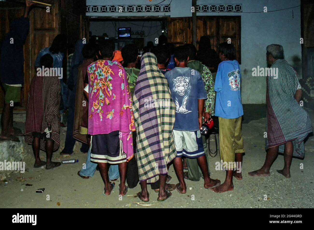 May 20, 2002-Atambua, Indonesia-In This Photos taken Independence day scene and Timorese daily life on 7day in Dili and Atambua Village.Refugees watching about Timor Independence live news at refugee camp office in Atambua, Indonesia. Stock Photo