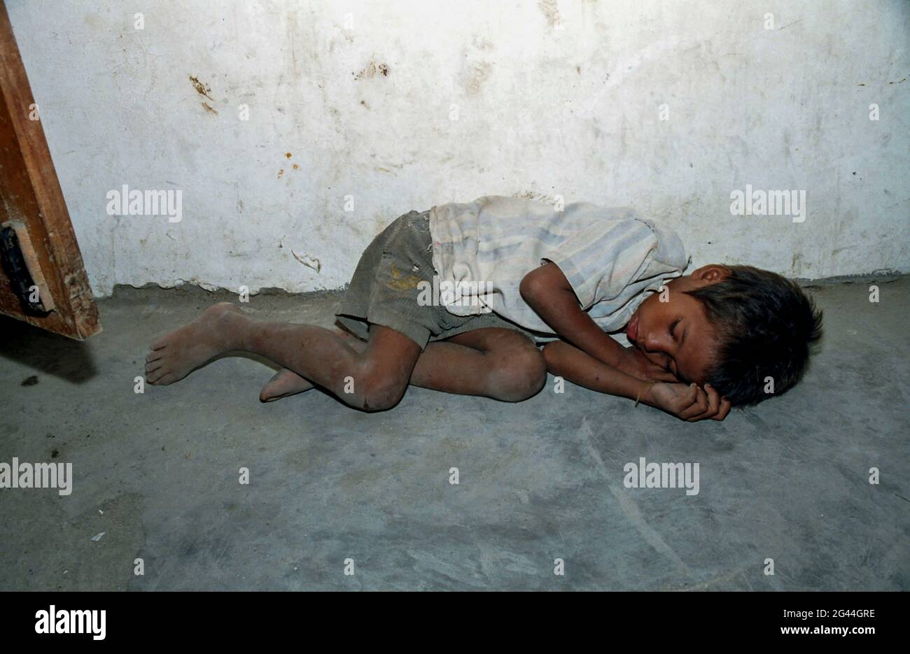 May 20, 2002-Atambua, Indonesia-In This Photos taken Independence day scene and Timorese daily life on 7day in Dili and Atambua Village. A Orphan boy sleep near refugee camp office in Atambua, Indonesia. Stock Photo