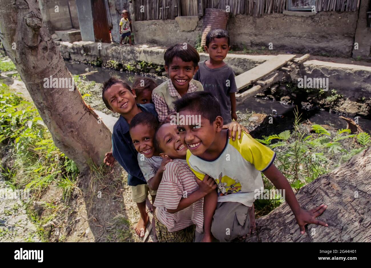 May 20, 2002-Dili, Timor-Leste-In This Photos taken Independence day scene and Timorese daily life on 7day in Dili and Atambua Village. Children look photographer camera with react at slum district in Dili, Timor-Leste. Stock Photo