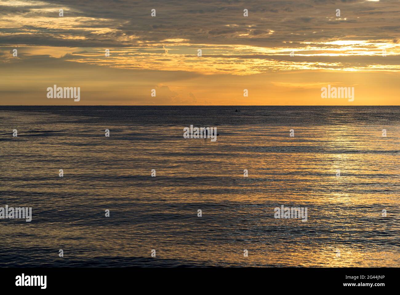 Fishing boat at sunset on Sulawesi Stock Photo