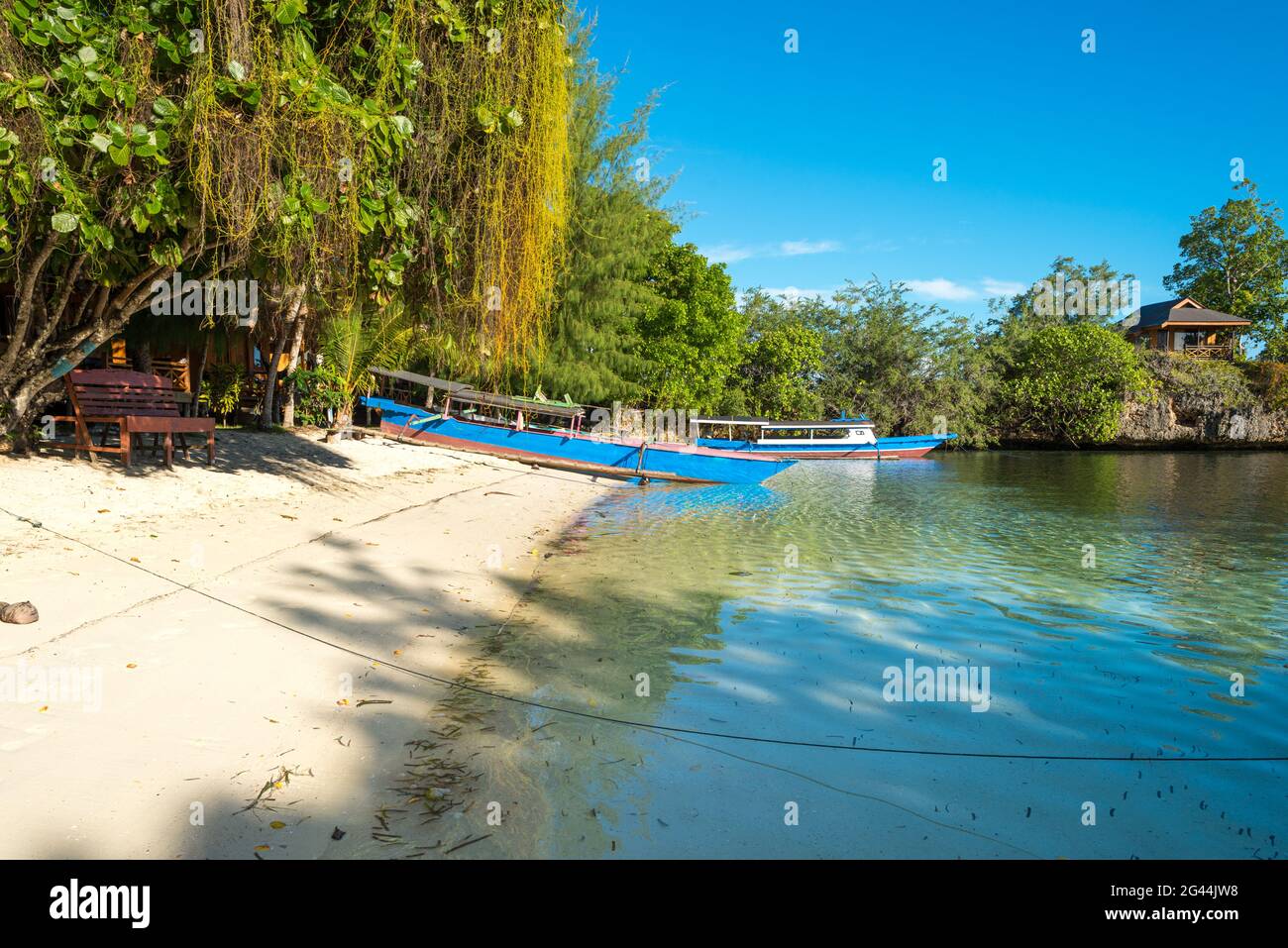 Boats on the beach of the small island of Poyalisa which is part of the Togian archipelago, Sulawesi Stock Photo