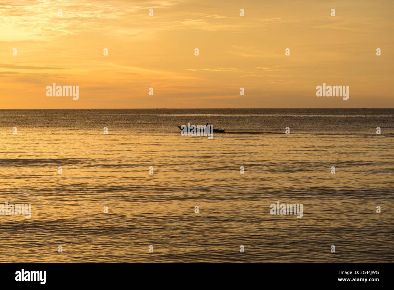 Fishing boat at sunset on Sulawesi Stock Photo