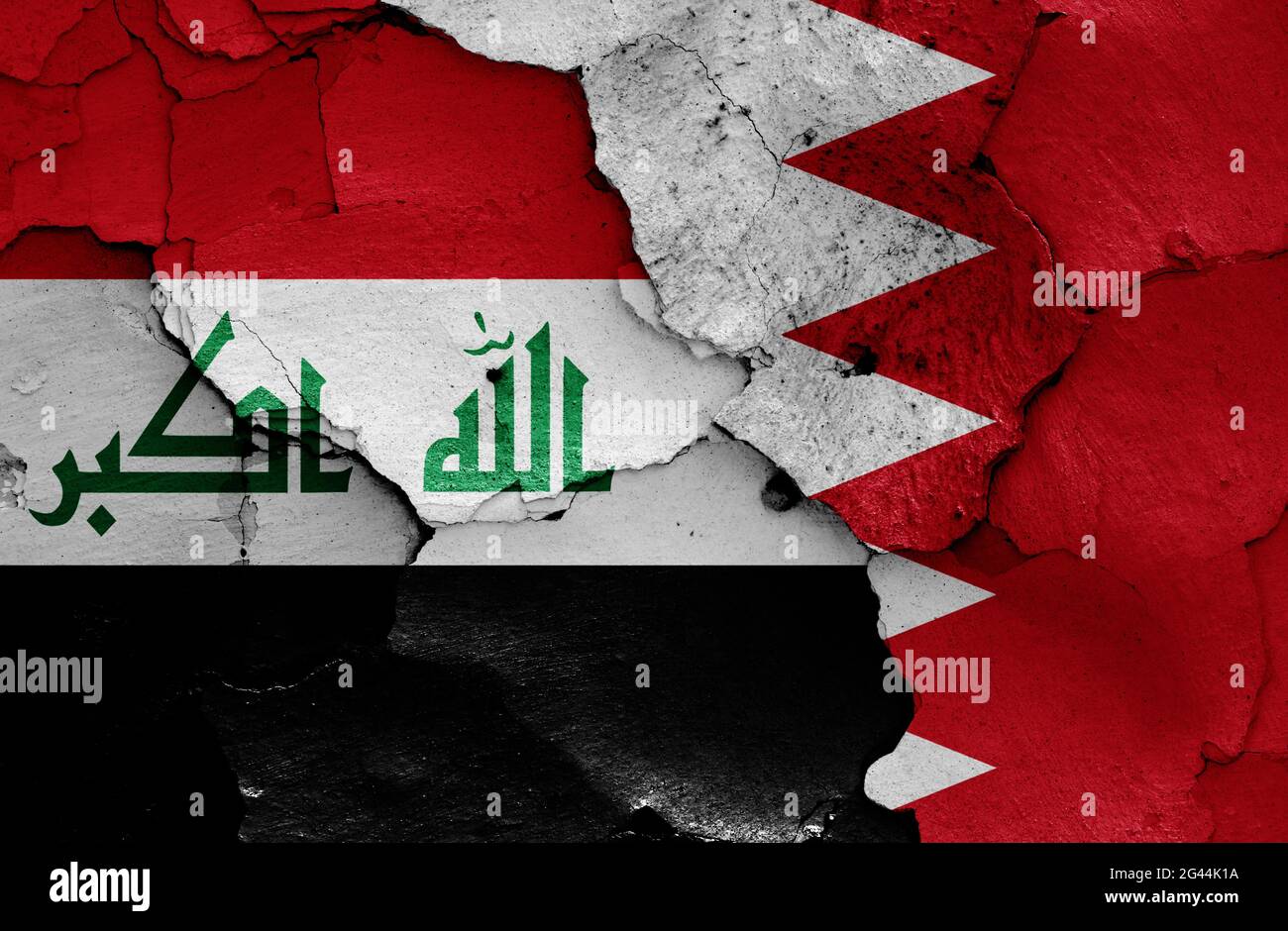 Flags of Iraq and Bahrain painted on cracked wall Stock Photo