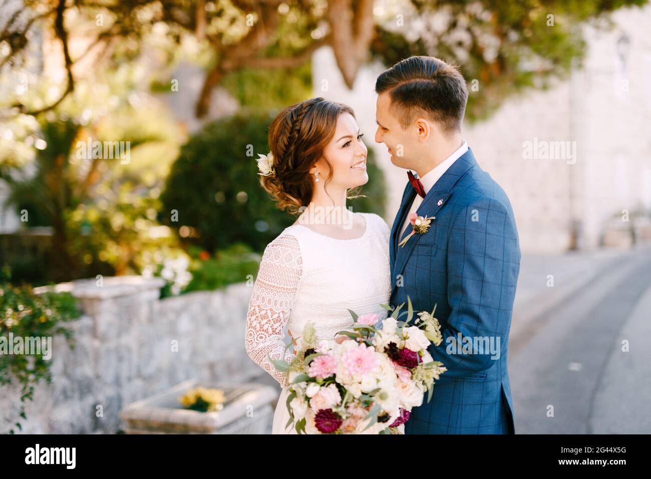 Woman tenderly holds bouquet hi-res stock photography and images - Alamy