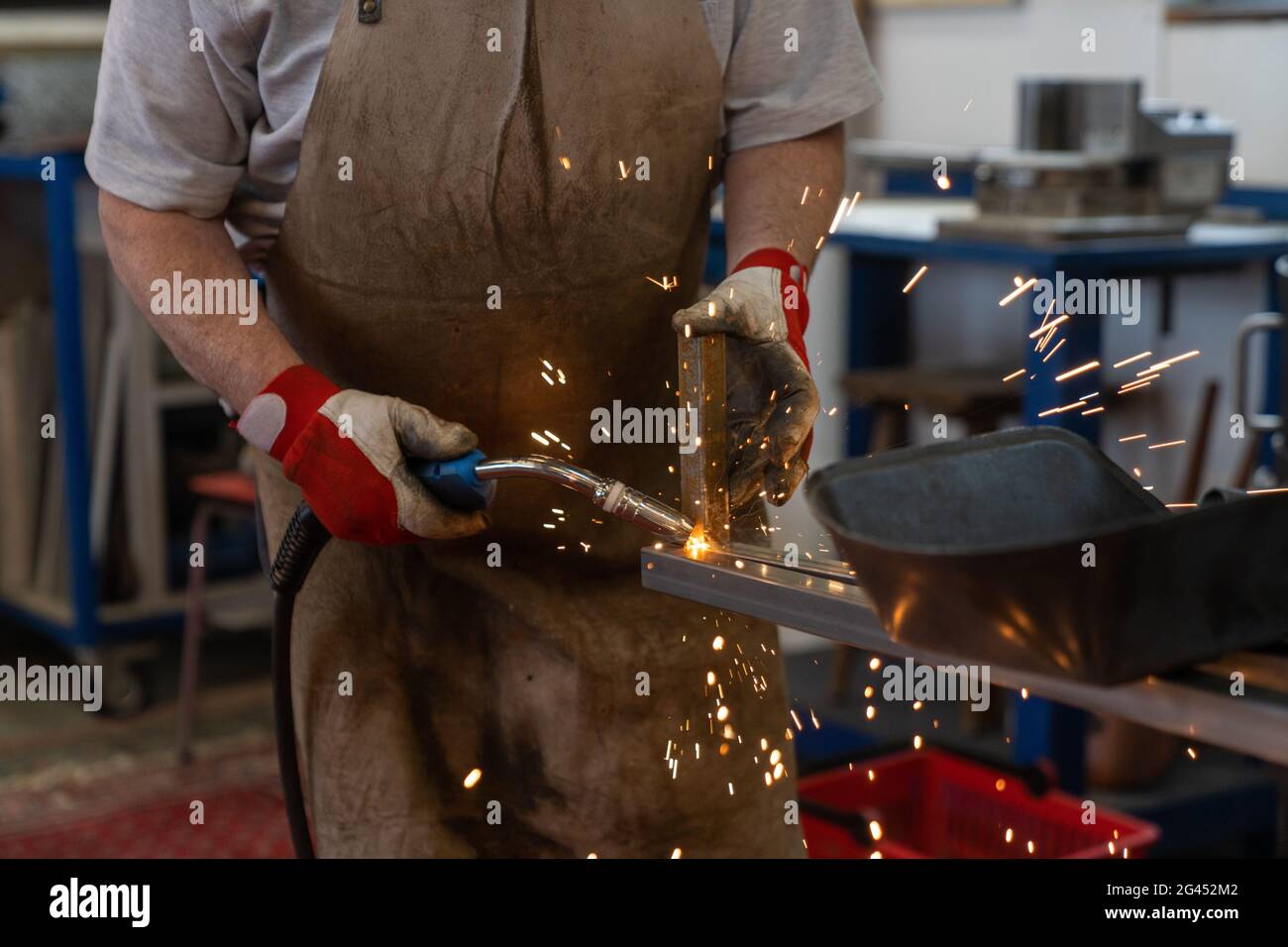 Man welding steel frames in a and metal works Stock