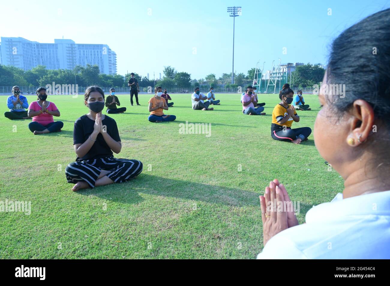 People doing rehearsal in the stadium for International Yoga Day, yoga camp started by AYUSH department india. Gurugram, Stock Photo