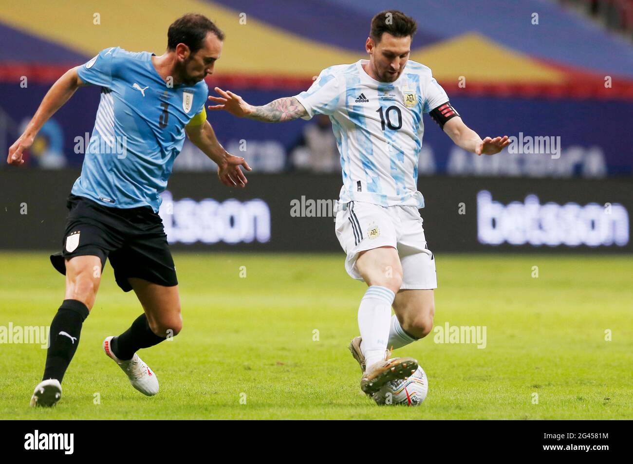 Brasilia, Brazil. 18th June, 2021. Argentina's Lionel Messi (R) vies with Uruguay's Diego Godin during the 2021 Copa America group A football match between Argentina and Uruguay in Brasilia, Brazil, June 18, 2021. Credit: Lucio Tavora/Xinhua/Alamy Live News Stock Photo