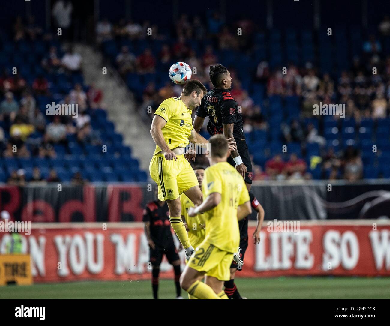 Harrison, USA. 18th June, 2021. Fabio Gomes Netto (9) of Red Bulls and Dave Romney (4) Nashvill fight for during regular MLS game at Red Bull Arena. Red Bulls