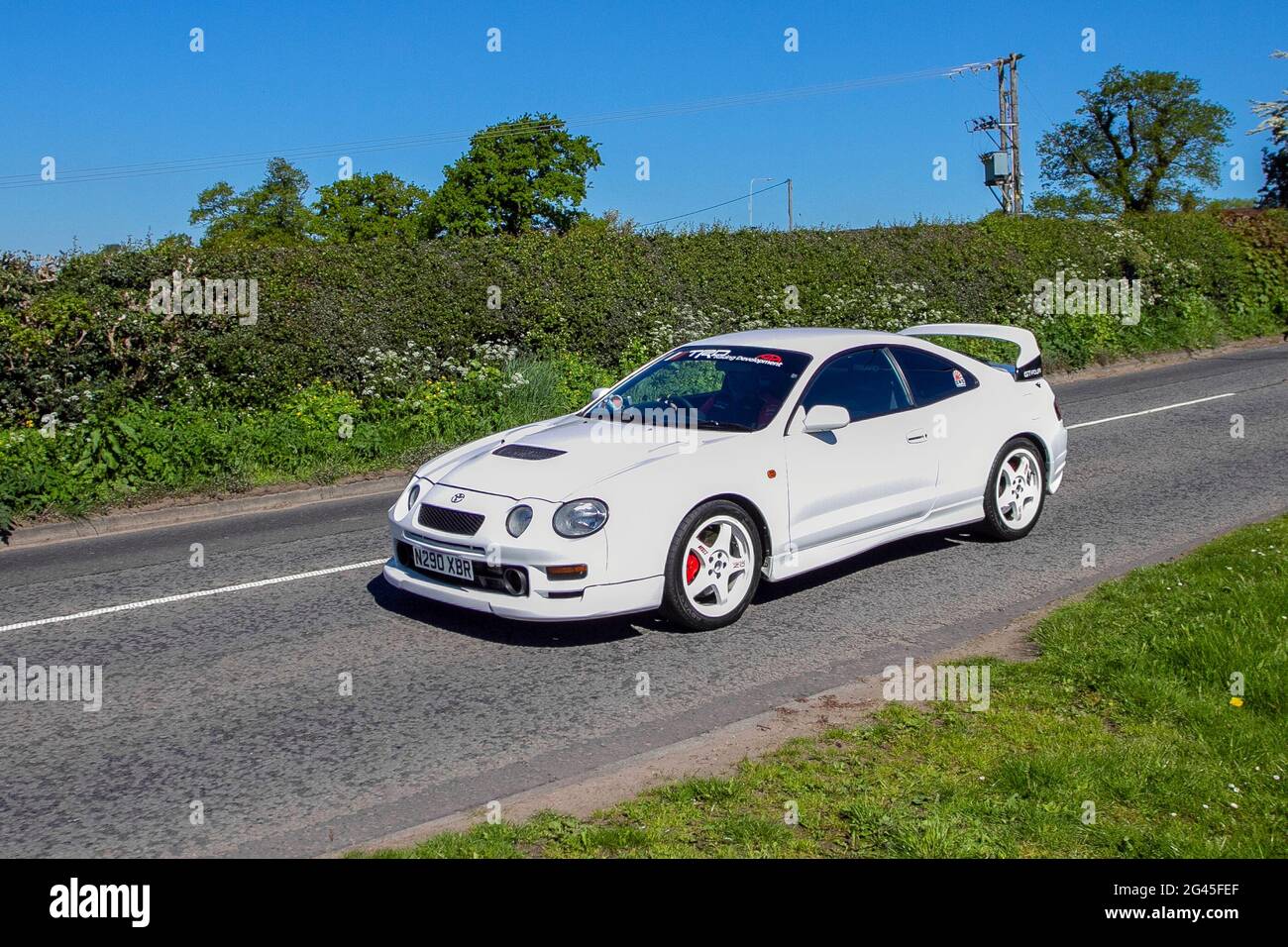 1996, 90s white Toyota Celica 1990cc petrol coupe en-route to