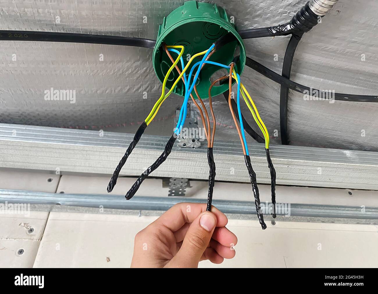 Electrical wiring of the junction box, installation, twisting of the box by  an electrician. Selective focus Stock Photo - Alamy