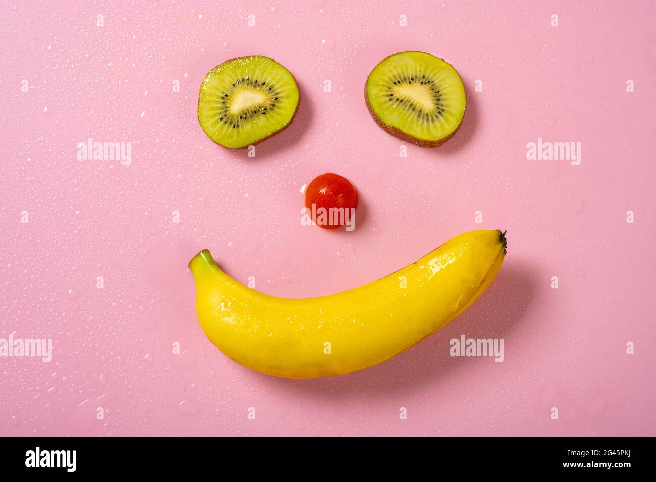 smiling face shaped by kiwi fruit and banana Stock Photo