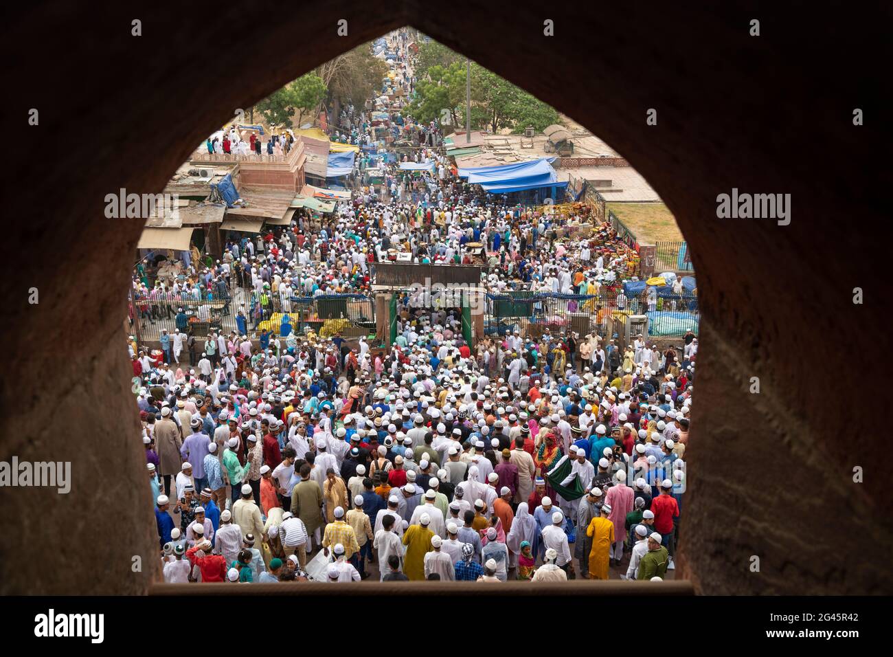 Muslim men leave after offering Eid-ul-Fitr namaz from the Masjid-i Jehan-Numa orJama Masjid of Delhi. It is one of the largest mosques in India Stock Photo