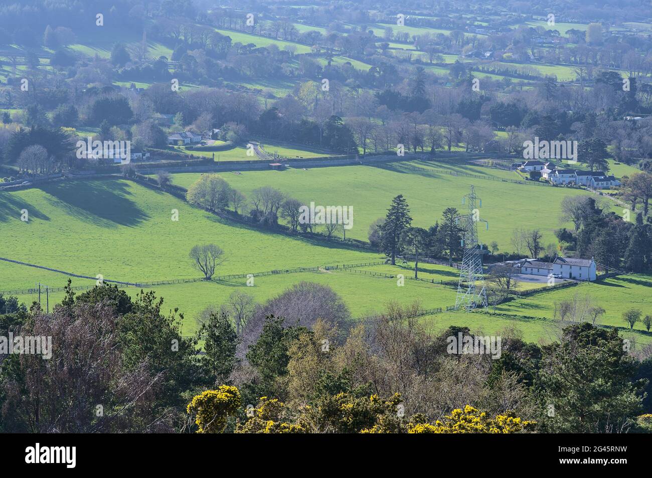 Beautiful bright aeriallike view of green fields, and high voltage