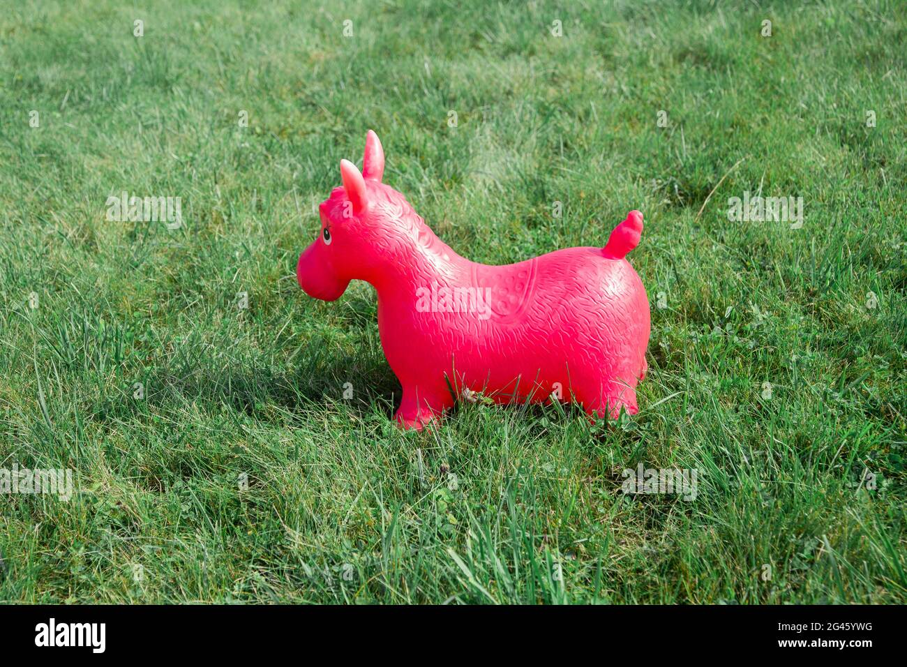 Red donkey children rubber toy outdoors Stock Photo Alamy