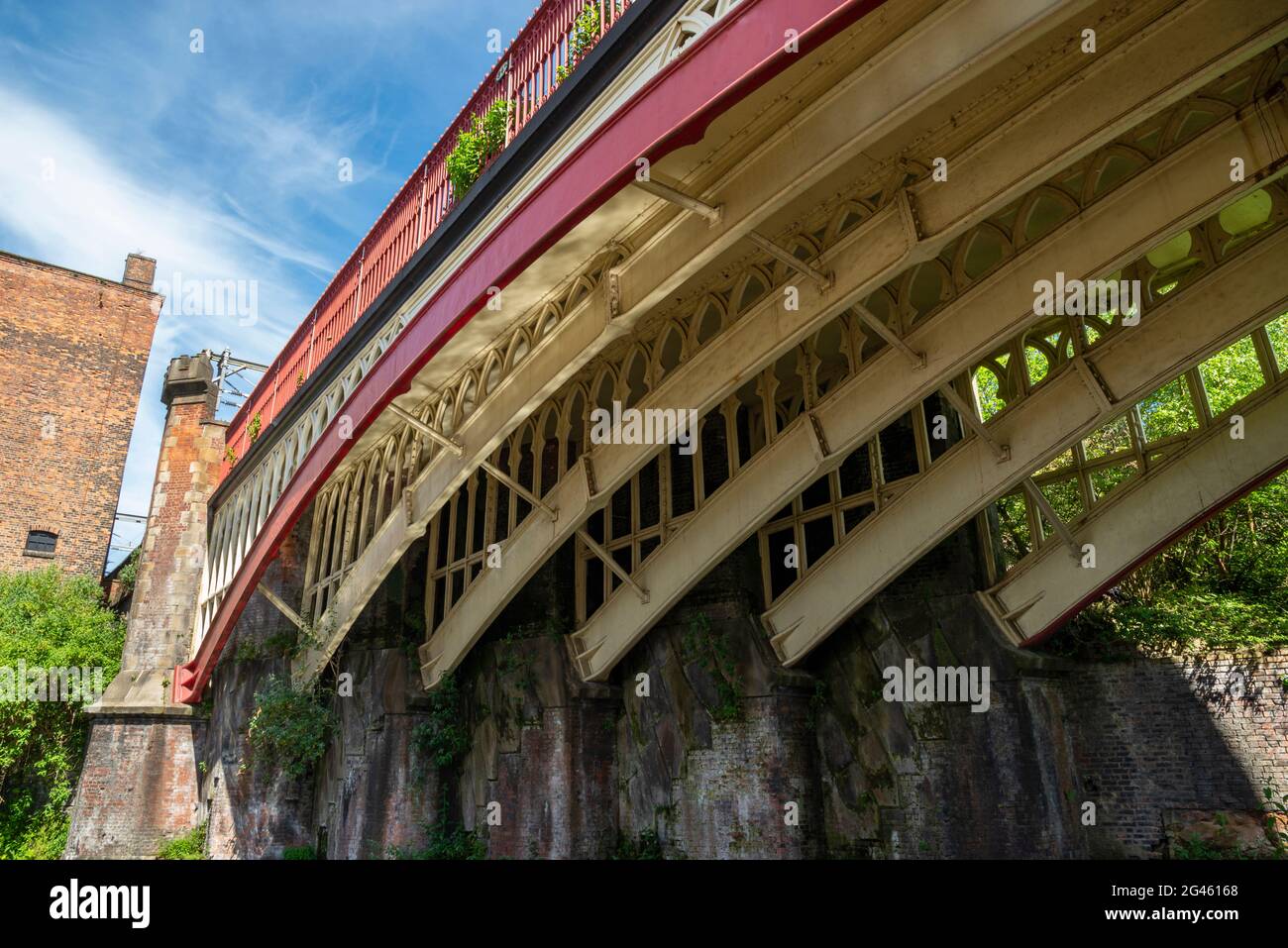 Old railway bridge over the Rochdale Canal at Deansgate in the centre of Manchester, Northern England. Stock Photo