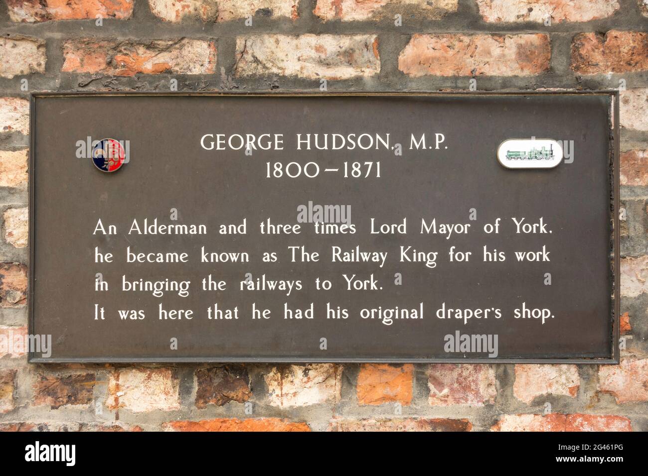 Plaque relating to George Hudson, The Railway King, mounted at the site of his drapers shop in College Street, York, Yorkshire, England, UK Stock Photo
