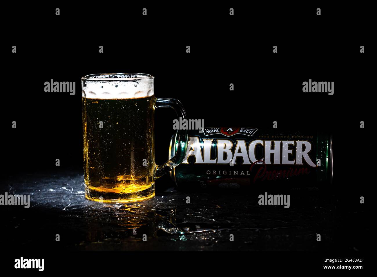 Can of Albacher beer and beer glass on dark background. Illustrative ...