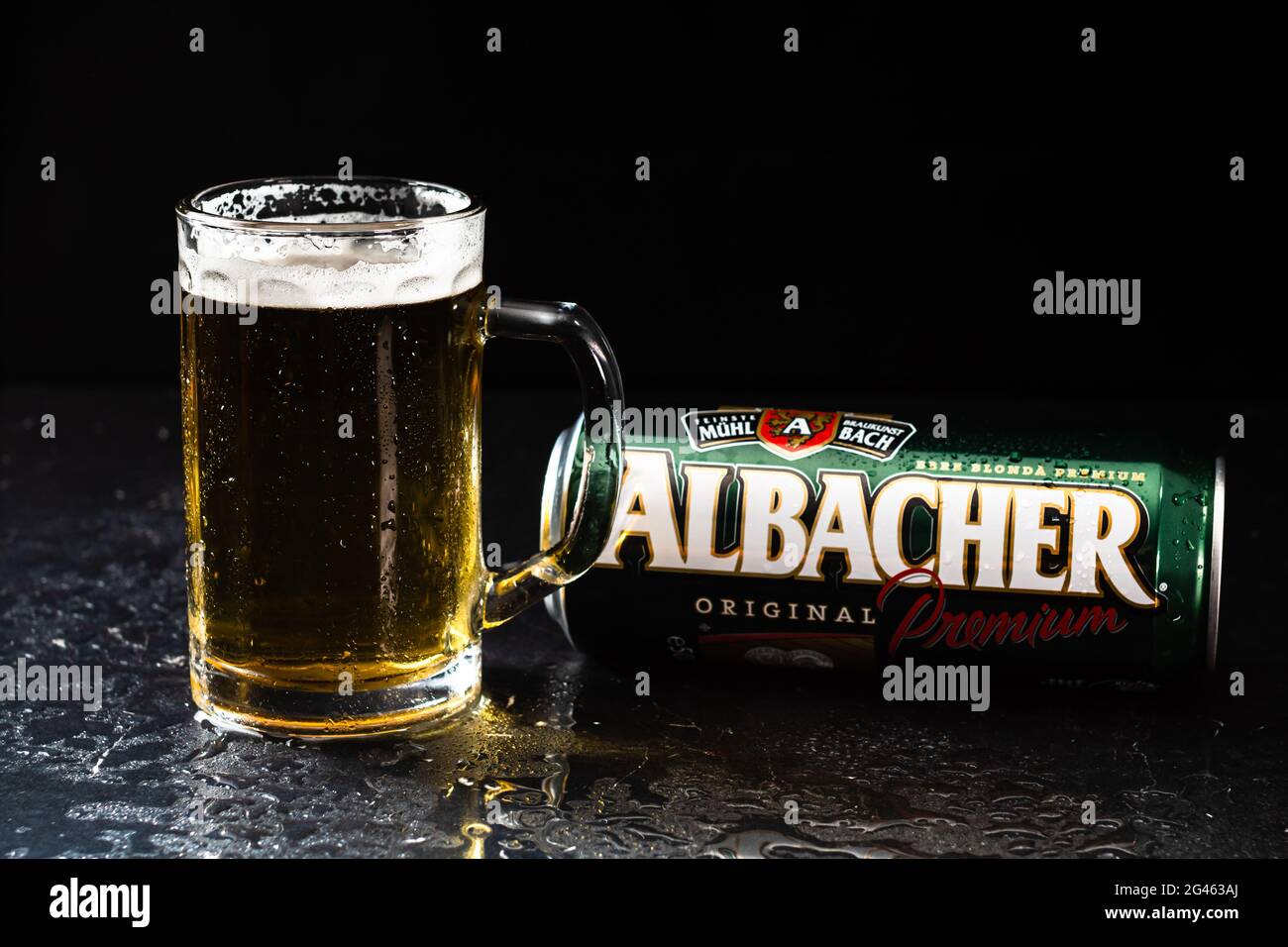 Can of Albacher beer and beer glass on dark background. Illustrative ...