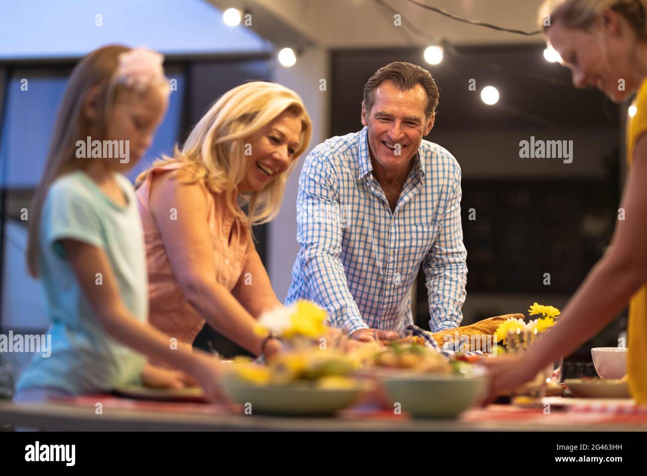 Multi-generation Caucasian family Setting a table Stock Photo - Alamy