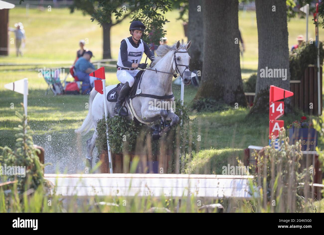 19 June 2021, Lower Saxony, Luhmühlen: Equestrian sport: German Championship, Eventing. The German event rider Christoph Wahler rides Carjatan S in the cross-country competition (5*-L). Photo: Friso Gentsch/dpa Stock Photo