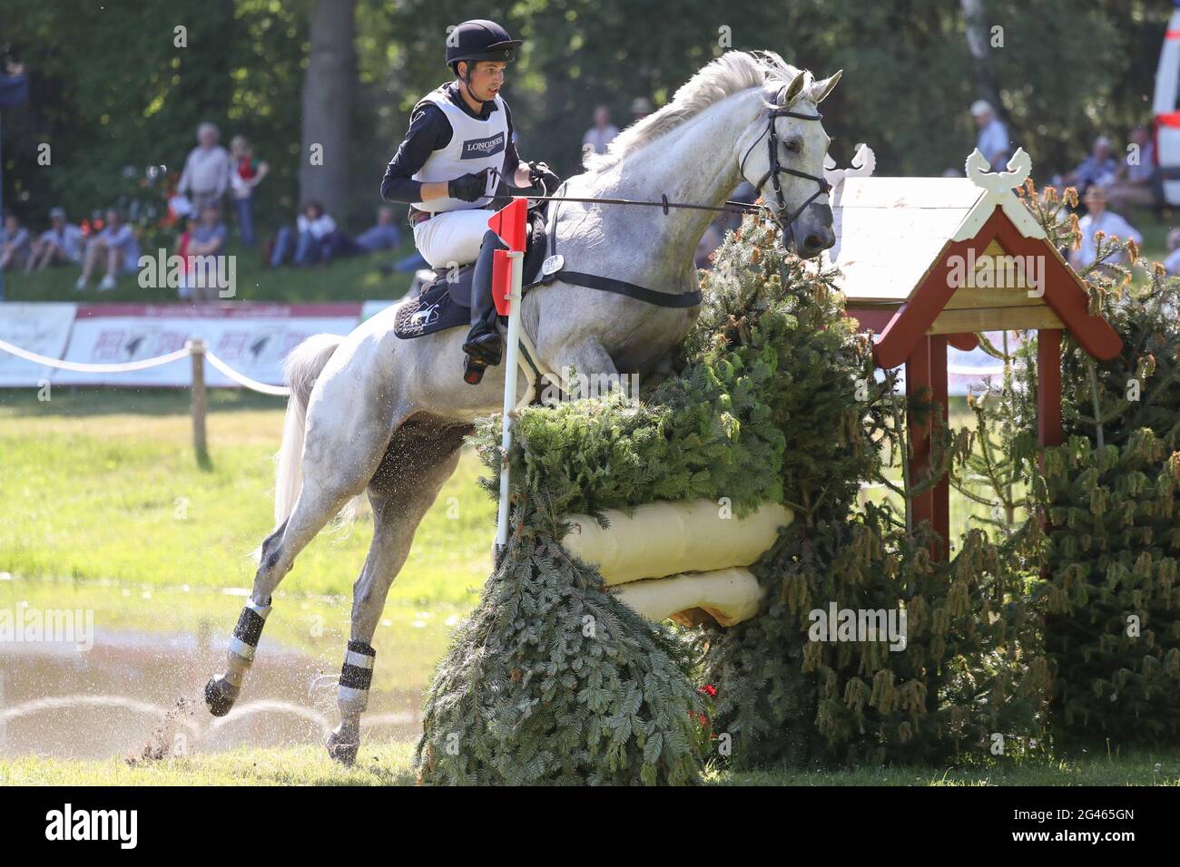 19 June 2021, Lower Saxony, Luhmühlen: Equestrian sport: German Championship, Eventing. The German event rider Christoph Wahler rides Carjatan S in the cross-country competition (5*-L). Photo: Friso Gentsch/dpa Stock Photo