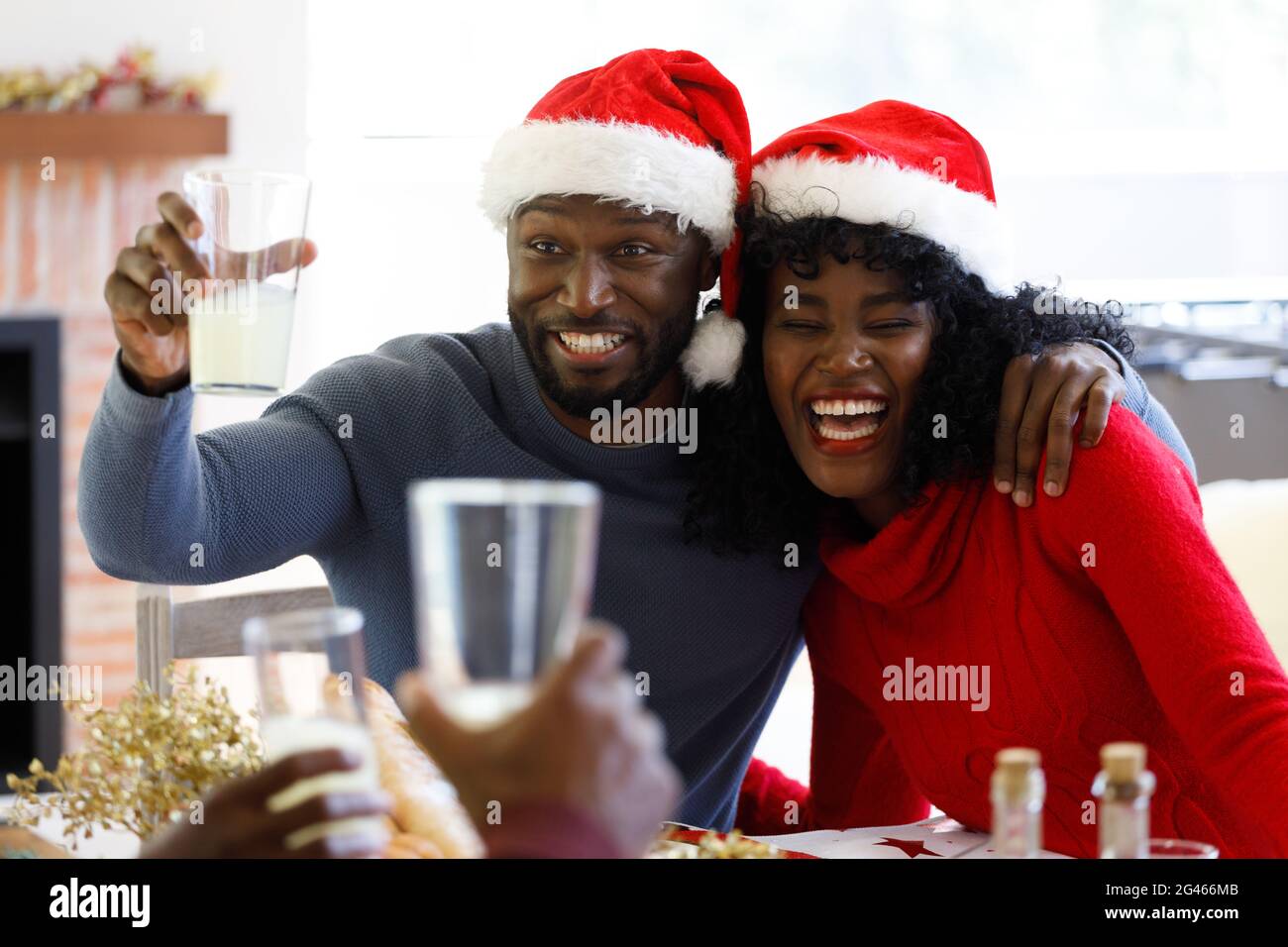 African american couple holding glass of juice Stock Photo - Alamy