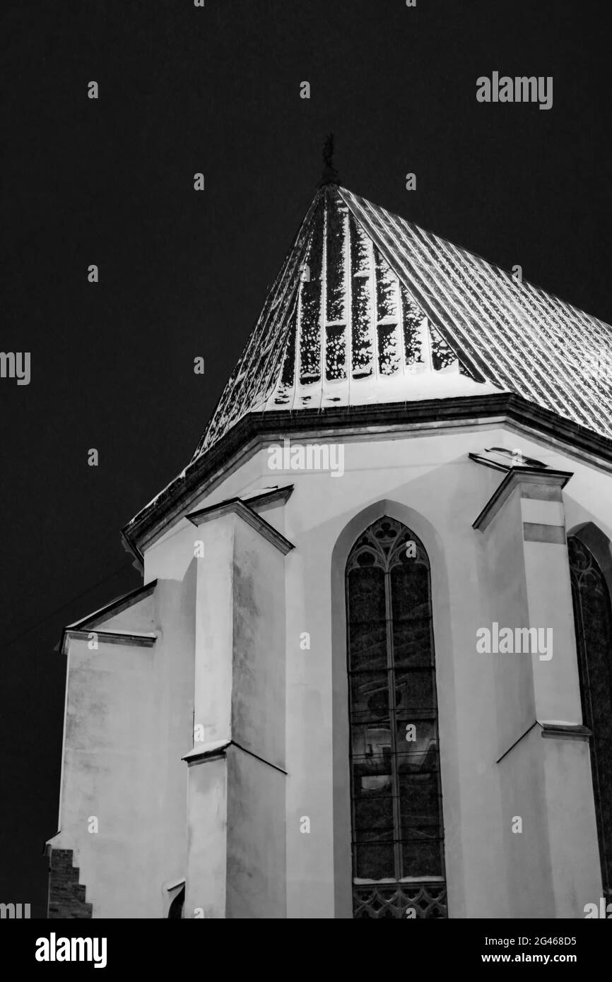 Vertical shot of the walls of an old church on dark background in ...
