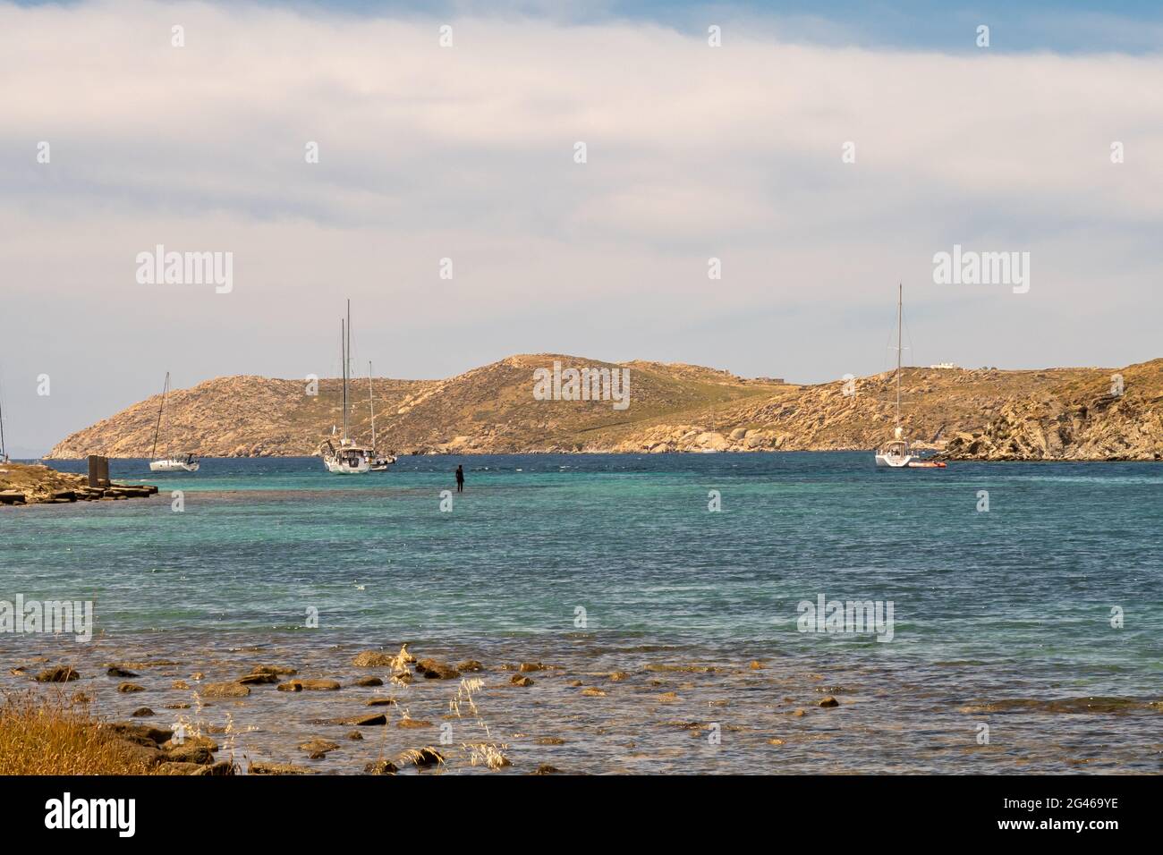 DELOS, Greece, 29/05/2019. Iron figures installed among ancient ruins on the island of Delos, Greece,  by artist Antony Gormley. Stock Photo