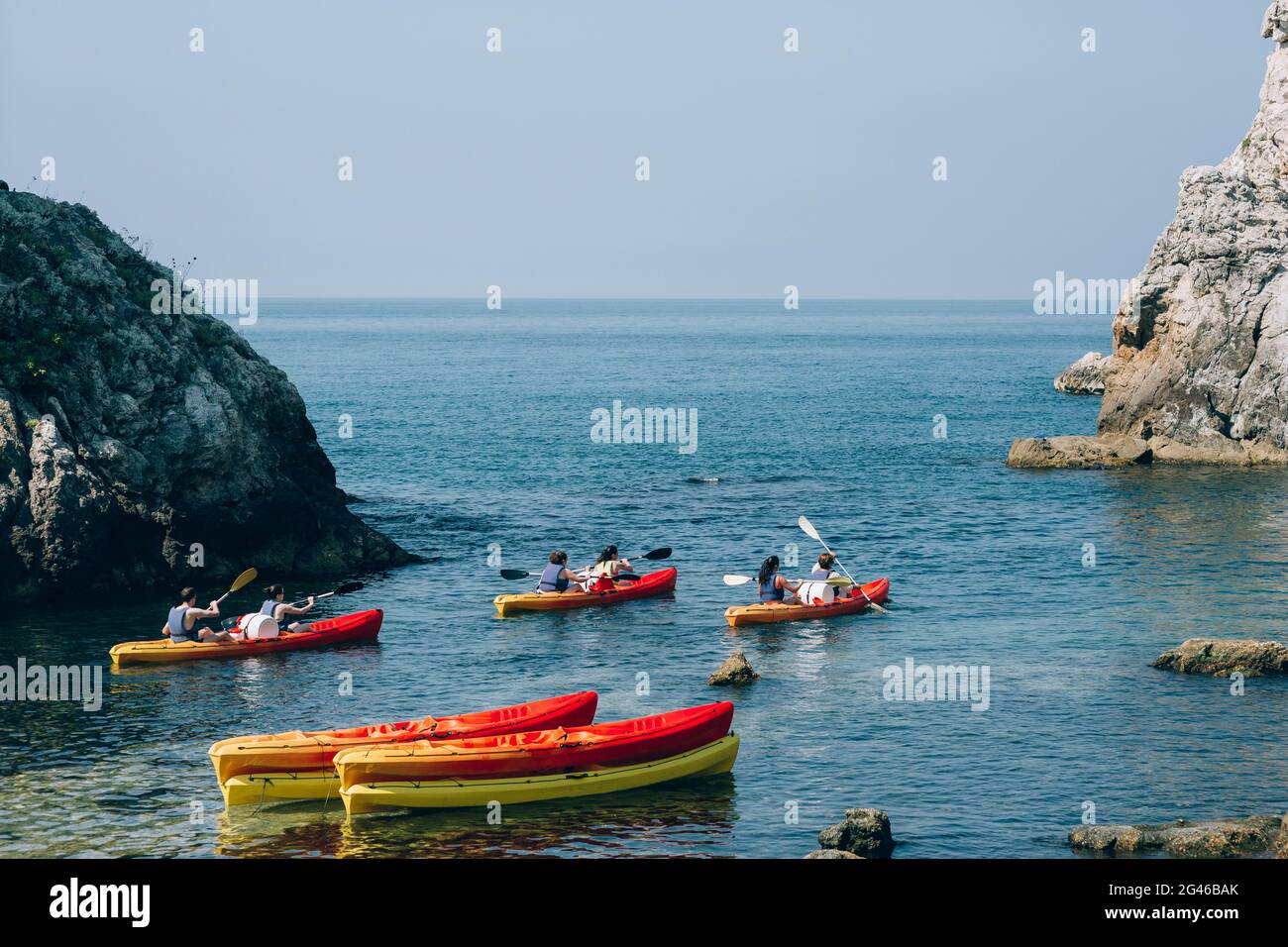 Kayaks at sea. Tourist kayaking in the sea near Dubrovnik, Croat Stock Photo