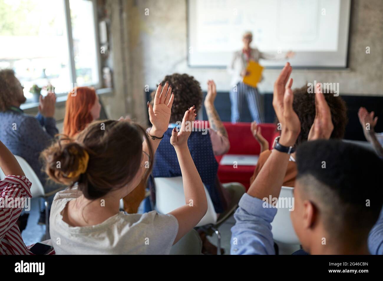 A group of young creative people are congratulating on an interesting ...
