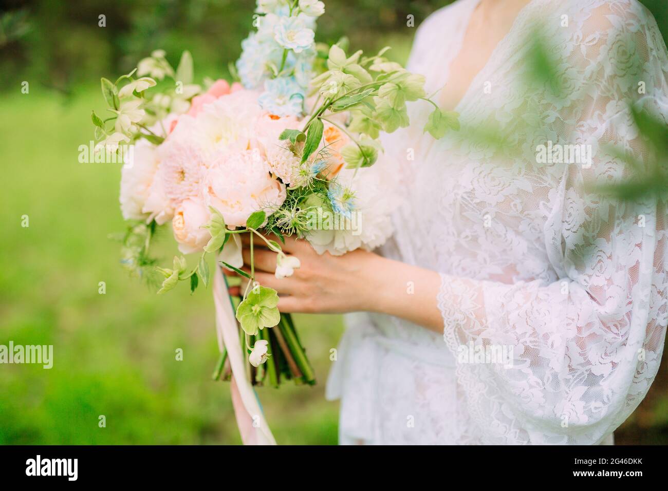 Wedding bouquet of peonies in the hands of the bride. Wedding in Stock ...