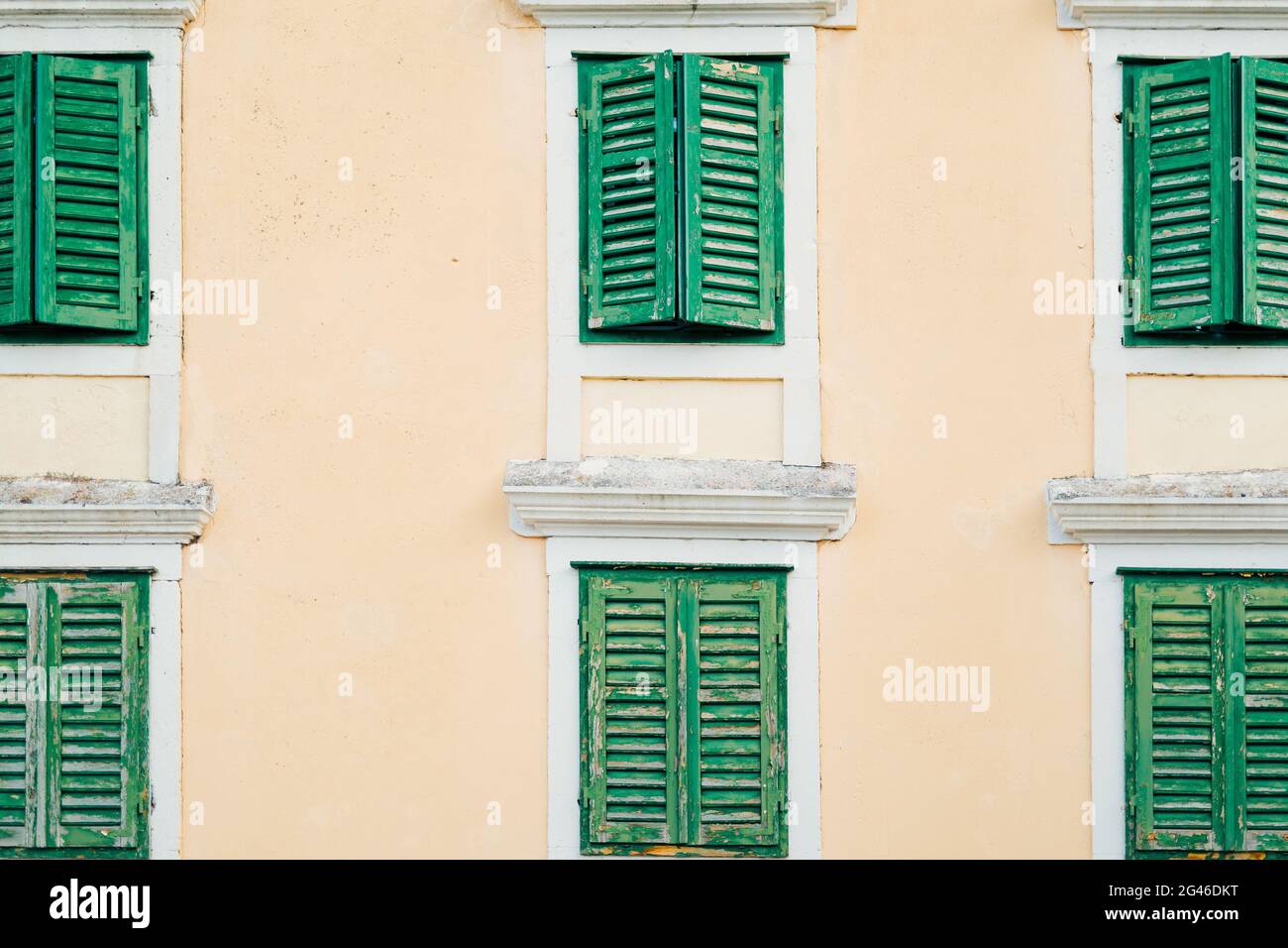 Green window shutters. The facade of houses Stock Photo